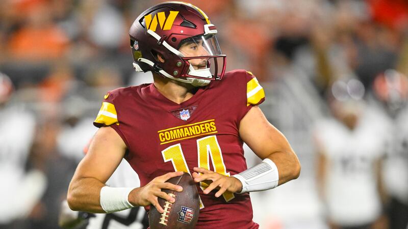 Washington Commanders quarterback Sam Howell looks to pass against the Cleveland Browns during...