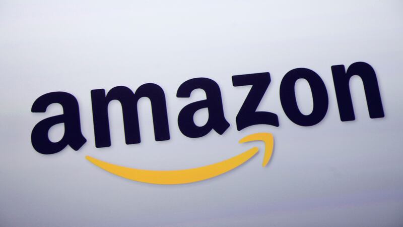 FILE - The Amazon logo is displayed at a news conference in New York on Sept. 28, 2011. Amazon...